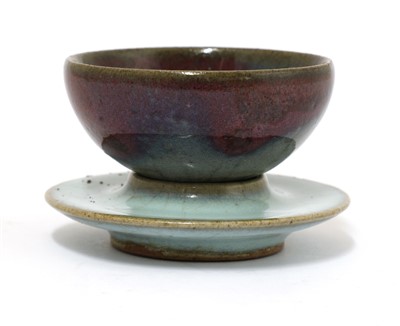 Lot 61 - A Chinese Jun ware tea bowl and stand