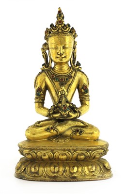 Lot 121 - A Tibetan gilt bronze bodhisattva