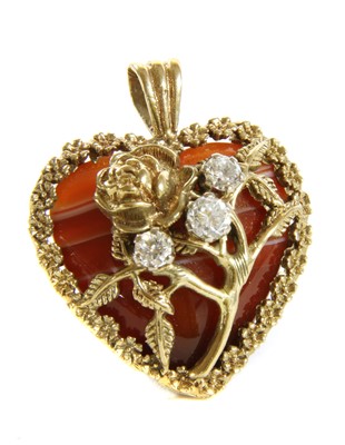 Lot 268 - A 9ct gold diamond and banded agate heart pendant