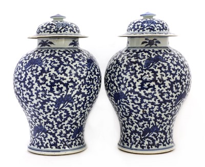 Lot 17 - A pair of Chinese blue and white vases and covers