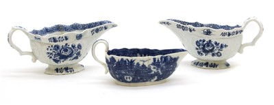 Lot 331 - A pair of 18th century blue and white sauce boats