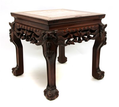 Lot 357 - A Chinese carved hardwood vase stand