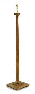 Lot 588 - An oak standard lamp