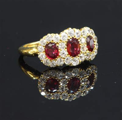 Lot 62 - An Edwardian ruby and diamond triple cluster ring, c.1900