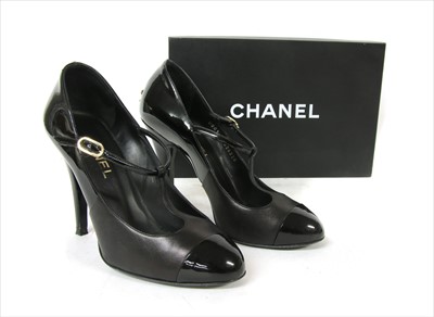 Lot 1035 - A pair of Chanel back patent leather T-bar shoes