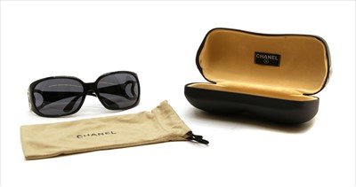 Lot 1128 - A pair of Chanel black framed sunglasses