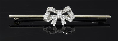 Lot 193 - A white gold diamond set bow brooch, c.1925