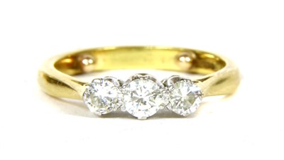 Lot 299 - An 18ct gold three stone diamond ring