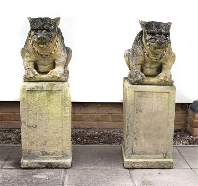 Lot 643 - A pair of composite stone statues on plinths