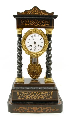 Lot 1025 - An ebonised portico eight day mantel clock