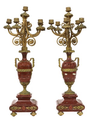 Lot 446 - A pair of Louis XV-style ormolu and rouge marble six-light candelabra