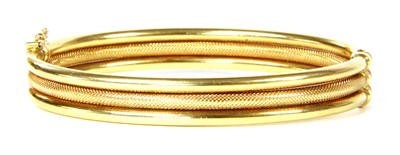 Lot 265 - An Italian gold three row bangle