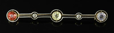 Lot 189 - A gold and platinum sapphire, tourmaline and diamond bar brooch, c.1915