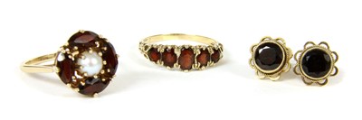 Lot 260 - A 9ct gold garnet five stone ring