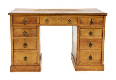 Lot 594 - An early 20th century ash pedestal desk