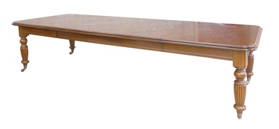 Lot 923 - A reproduction mahogany extending dining table