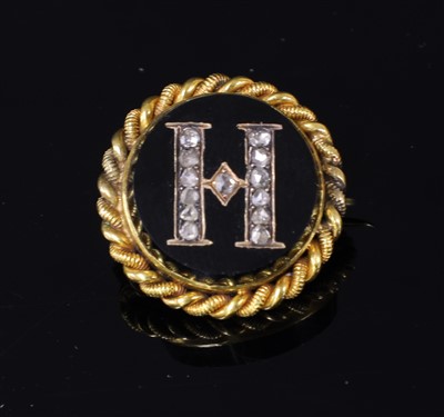 Lot 54 - A Victorian gold cased and diamond set initial brooch