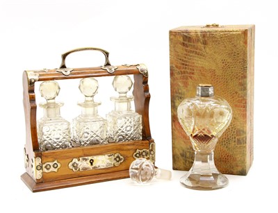 Lot 249 - A small oak cased tantalus