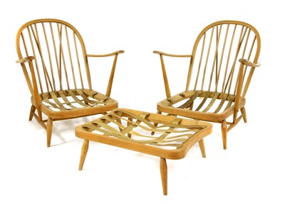 Lot 512 - A pair of Ercol beech and elm Windsor elbow chairs