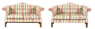 Lot 707 - A pair of Kingcome walnut camel back settees