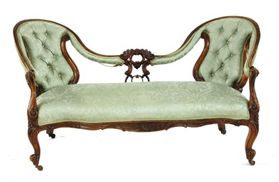 Lot 557 - A Victorian walnut serpentine fronted chair back settee