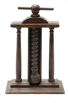 Lot 639 - A rustic elm nutcracker or juicer