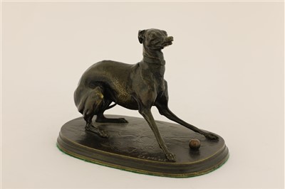 Lot 190 - A bronze model of a whippet with a ball