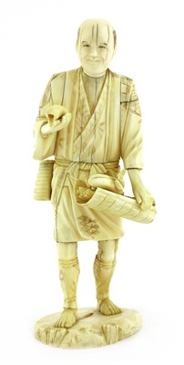 Lot 126 - A Japanese carved ivory figure of a vegetable seller