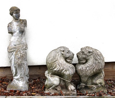 Lot 646 - A pair of reconstituted stone garden statues depicting lions