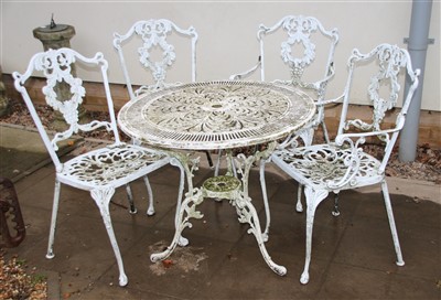 Lot 644 - A Victorian design garden table and four chairs
