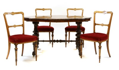 Lot 547 - A Victorian carved and inlaid oval centre table