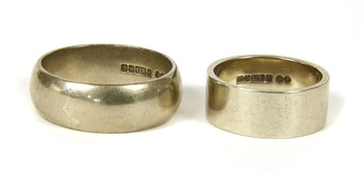 Lot 1053 - A 9ct white gold flat section wedding ring
