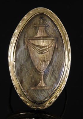 Lot 16 - A Georgian gold navette-shaped memorial ring, c.1787
