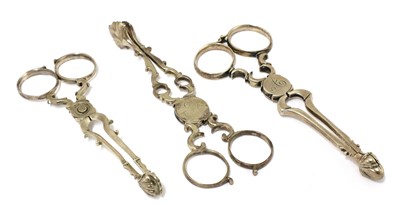Lot 52 - A pair of silver sugar nips