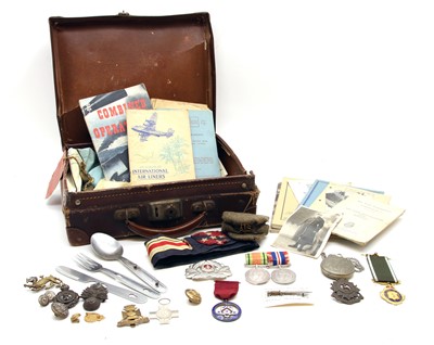 Lot 124 - A small WWII suit case