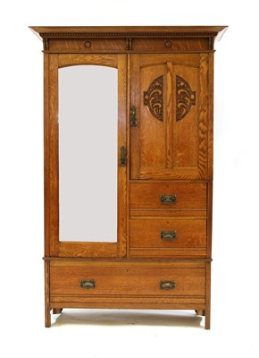Lot 530 - A Scottish oak Arts & Crafts compactum wardrobe