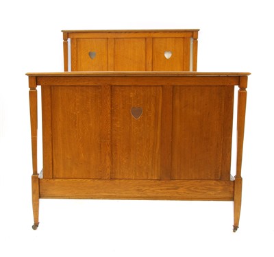 Lot 601 - An Arts & Crafts oak bedstead