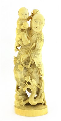 Lot 128 - A Japanese carved ivory group
