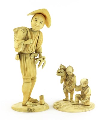 Lot 130 - Two Japanese carved ivory sectional figures