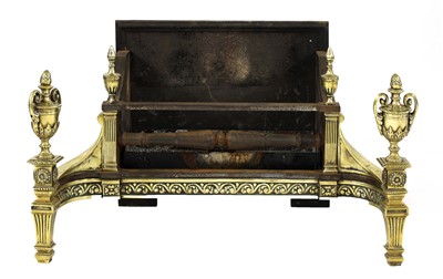 Lot 657 - A cast iron and brass fire basket