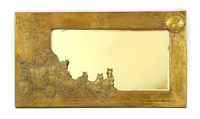Lot 622 - An Arts and Crafts style brass framed wall mirror of rectangular form