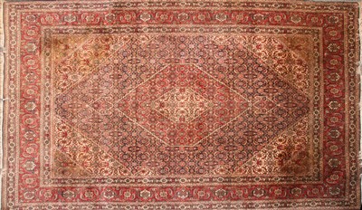 Lot 612 - An ivory ground Qashqai rug