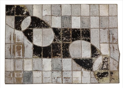 Lot 665 - An animal hide carpet