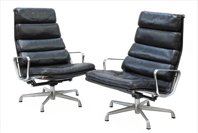 Lot 691 - A pair of 'EA438' lounge chairs and matching ottomans