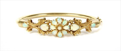 Lot 100 - A 9ct gold opal bangle
