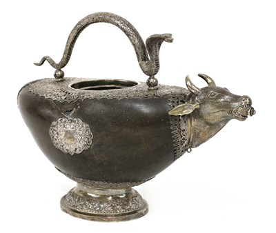 Lot 96 - An Indian coco de mer and white metal water carrier (goumukhi)