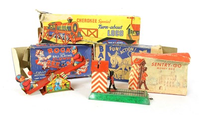Lot 1183 - Four vintage tinplate toys