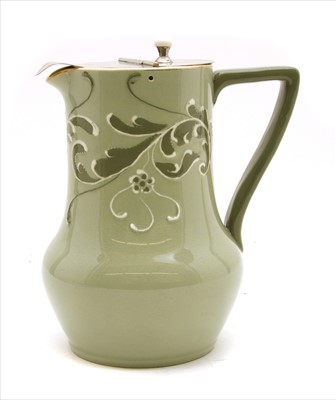 Lot 134 - A Moorcroft MacIntyre 'Gesso Faience' lidded jug