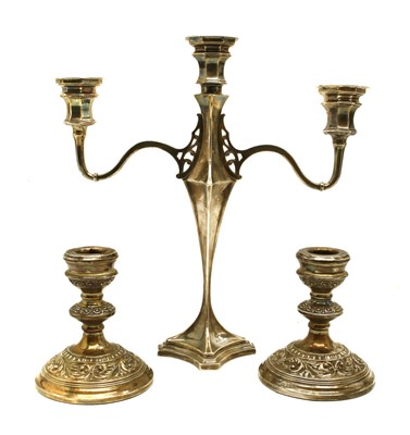 Lot 1140 - A pair of silver dwarf candlesticks