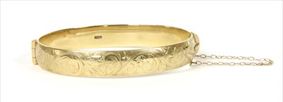 Lot 45 - A 9ct gold hinged bangle